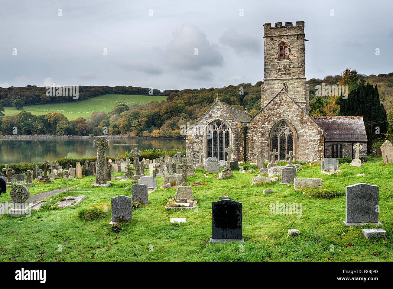 The 15th century church at St Winnow bank of the River Fowey in Cornwall Stock Photo