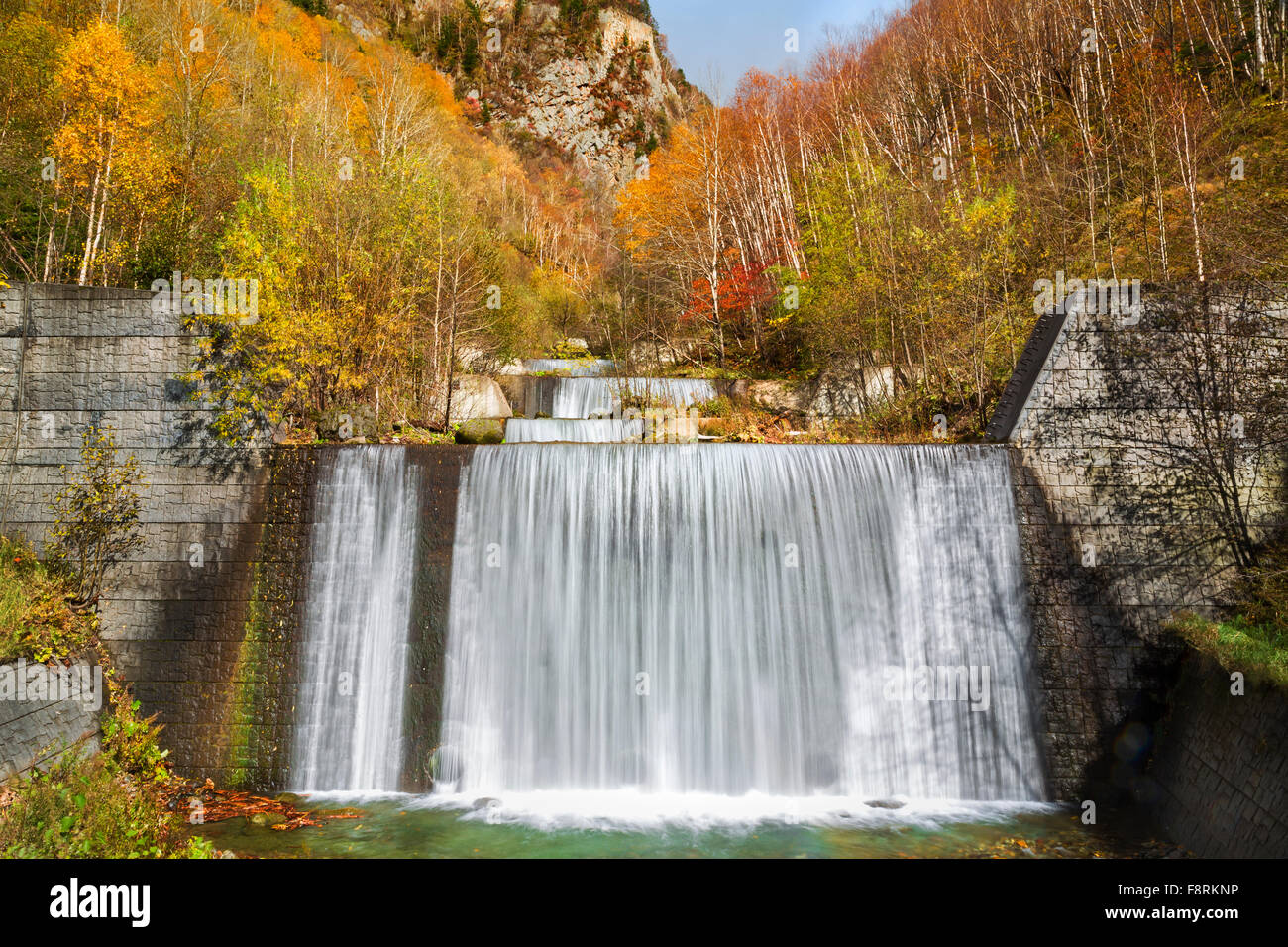 Forest waterfall in autumn Hokkaido, Japan Stock Photo
