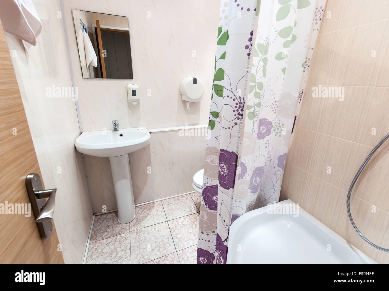combined bathroom with sink toilet and shower tray Stock Photo