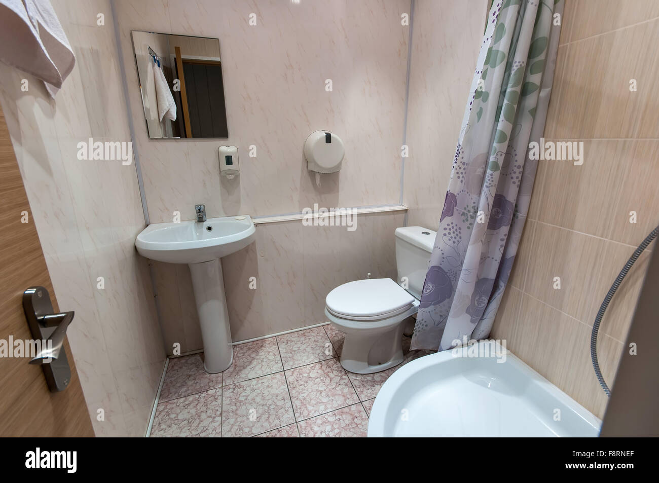 combined bathroom with sink toilet and shower tray Stock Photo Alamy