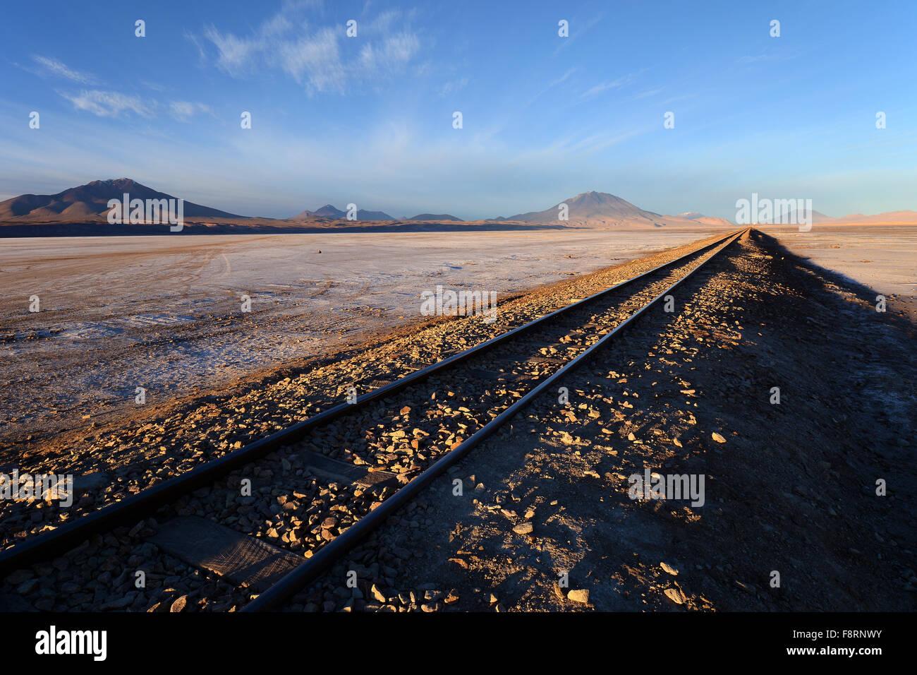 Railway track in the morning light, near Cementerio de los trenes, Uyuni, Bolivia Stock Photo