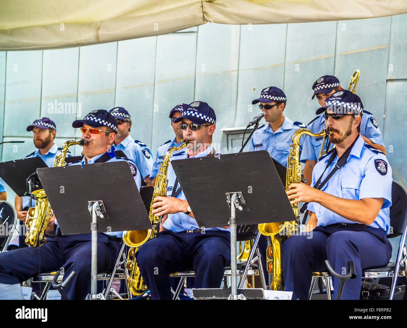 Victoria Police uniformed officers perform live as a brass band at
