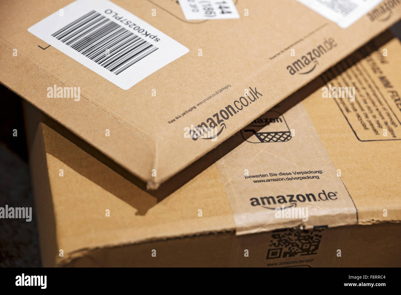 Close up of Amazon packages package parcels parcel carton home internet shopping delivery England UK United Kingdom GB Great Britain Stock Photo