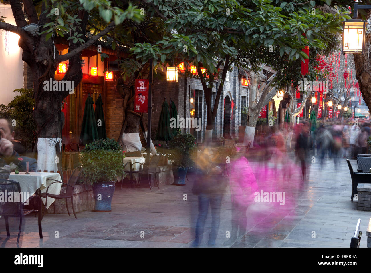 Kuan alley or road is the main road running through the restored and touristy old quarter of Kuan Zhai in Chengdu. Stock Photo