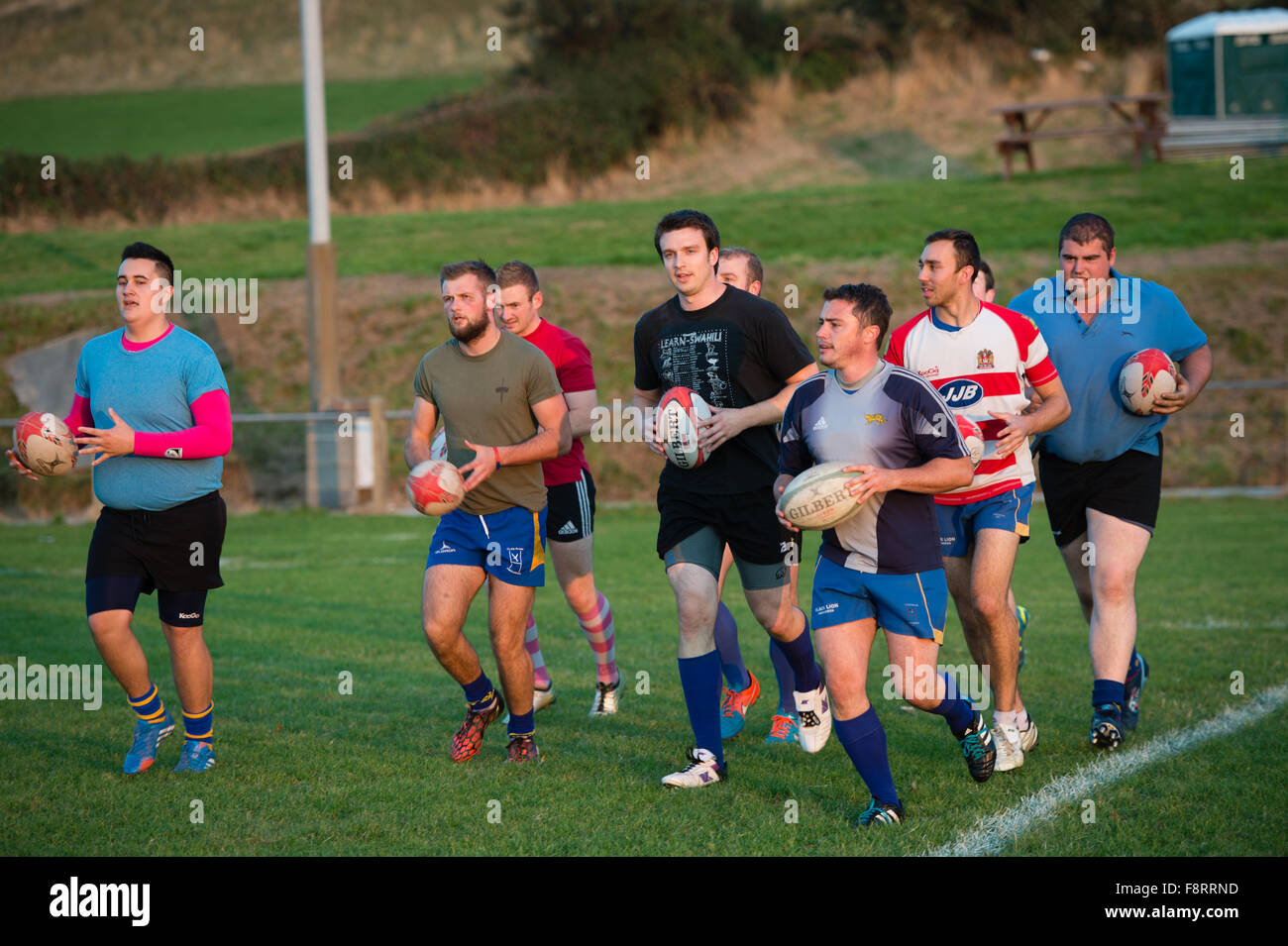 A group team squad of young men boys  taking part in rugby training coaching practice, Aberaeron Wales UK Stock Photo