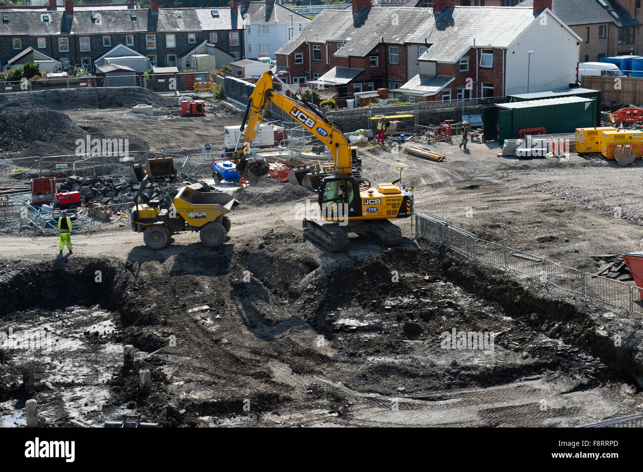 Urban Regeneration: Work prgressing to lay the foundations for a new branch of Marks and Spencers and a Tesco supermarket , on the brownfield former council yard site, Mill Street, Aberystwyth Wales UK, September 2015 Stock Photo