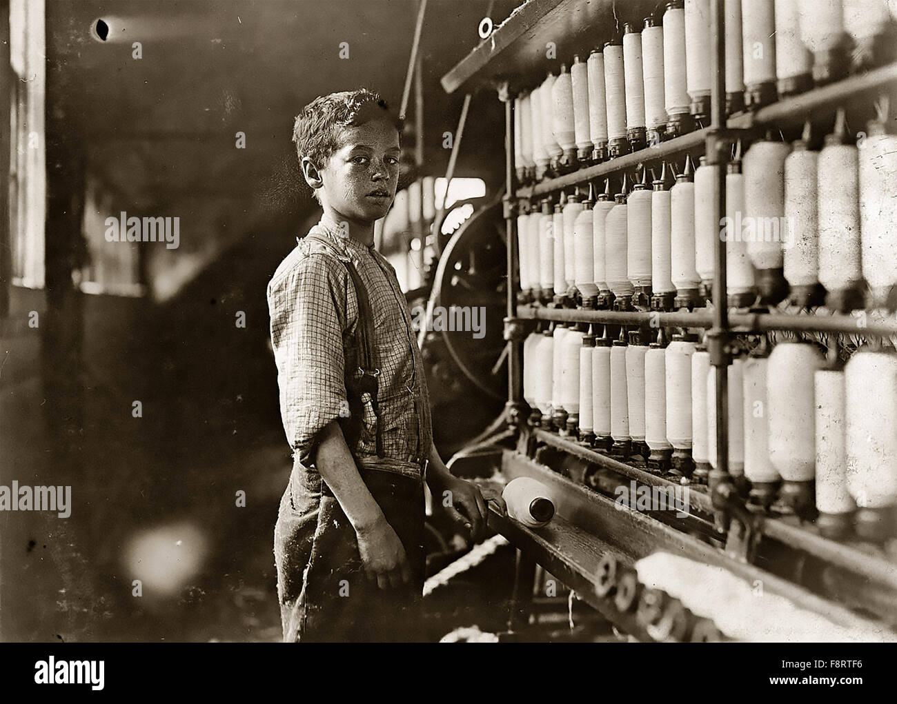 LEWIS HINE (1874-1940) American photographer and sociologist. One of his photos of children working in cotton mills about 1908 Stock Photo