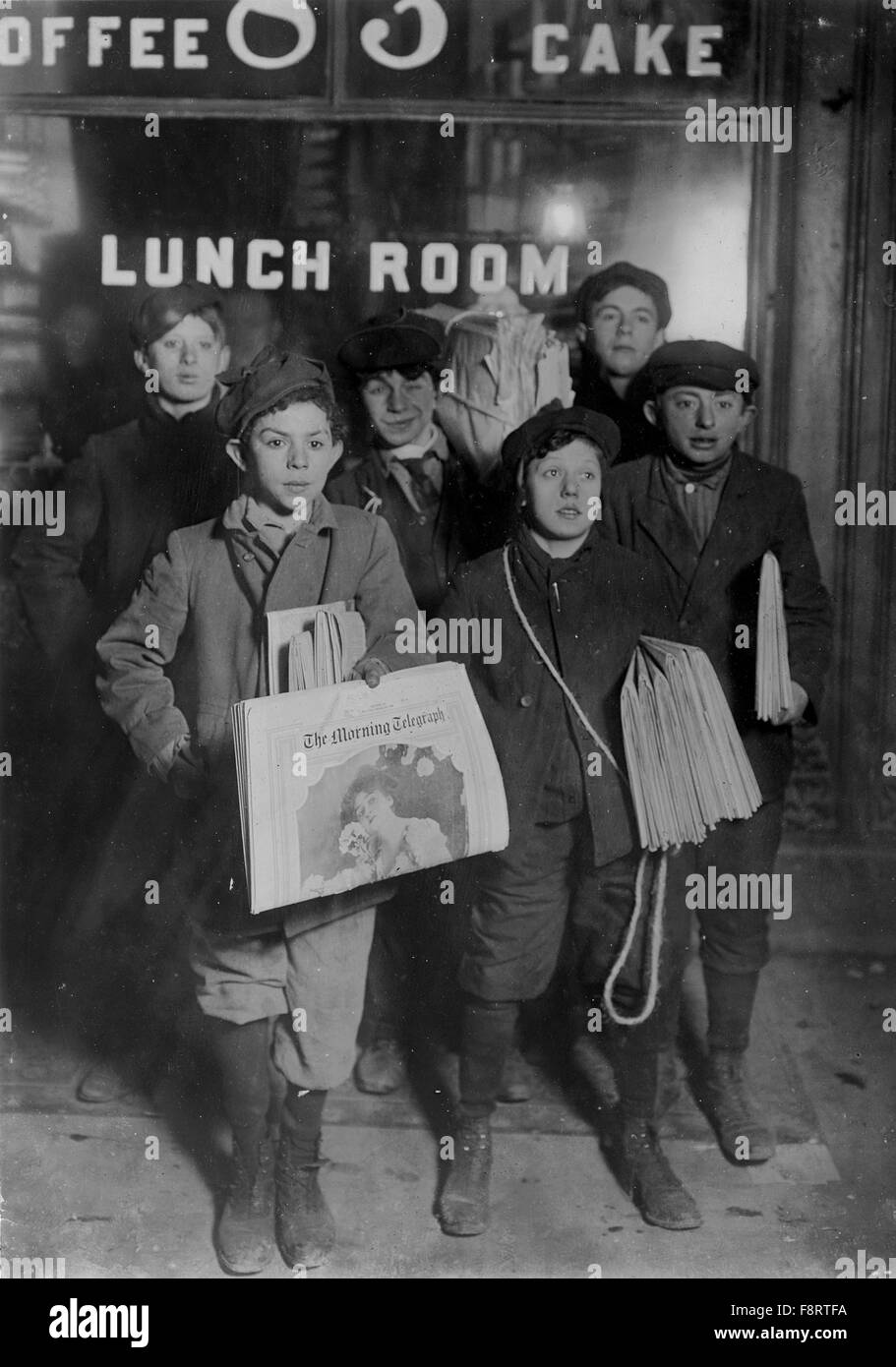 LEWIS HINE (1874-1940) American sociologist and photographer. His photo of children selling newspapers on Brooklyn Bridge at 3.0 am 23 February 1908 was part of a series taken for the National Child Labor Committee. Stock Photo