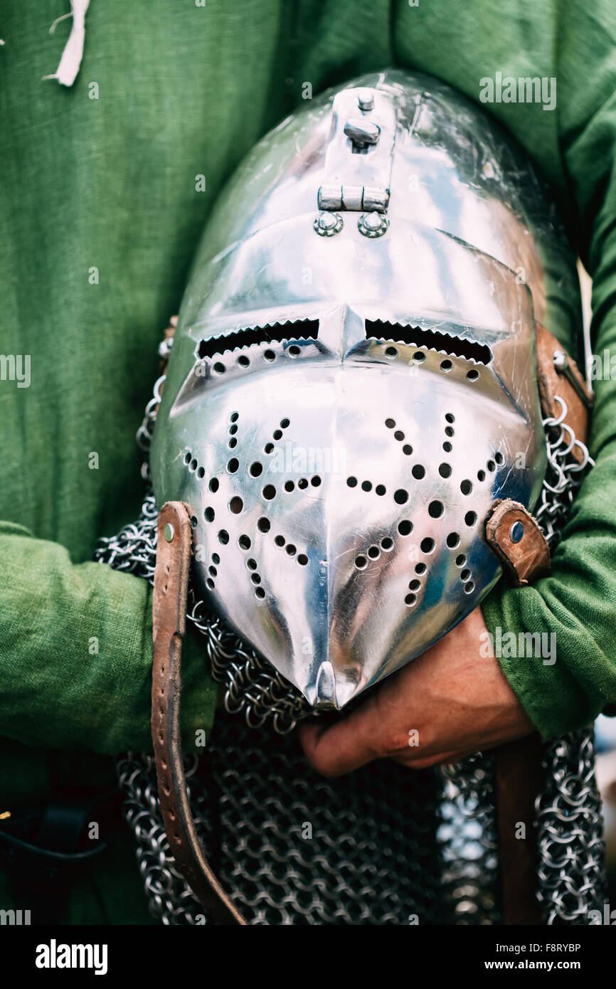 Iron Helmet Of The Medieval Knight. Helmet Of A Medieval Suit Of Armour In Hands Stock Photo