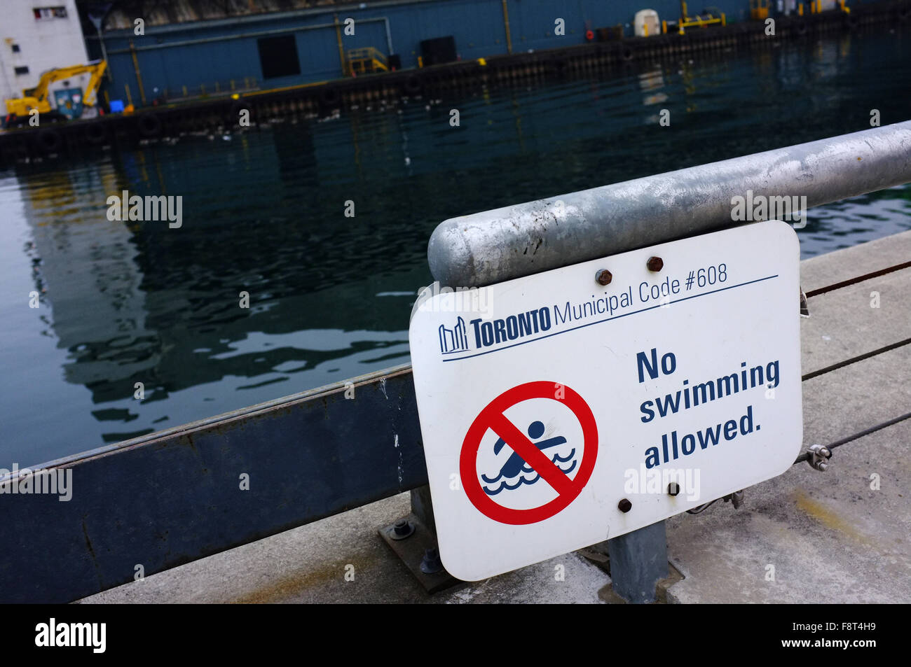 A No swimming allowed sign in the East Bayfront area of Toronto. Stock Photo