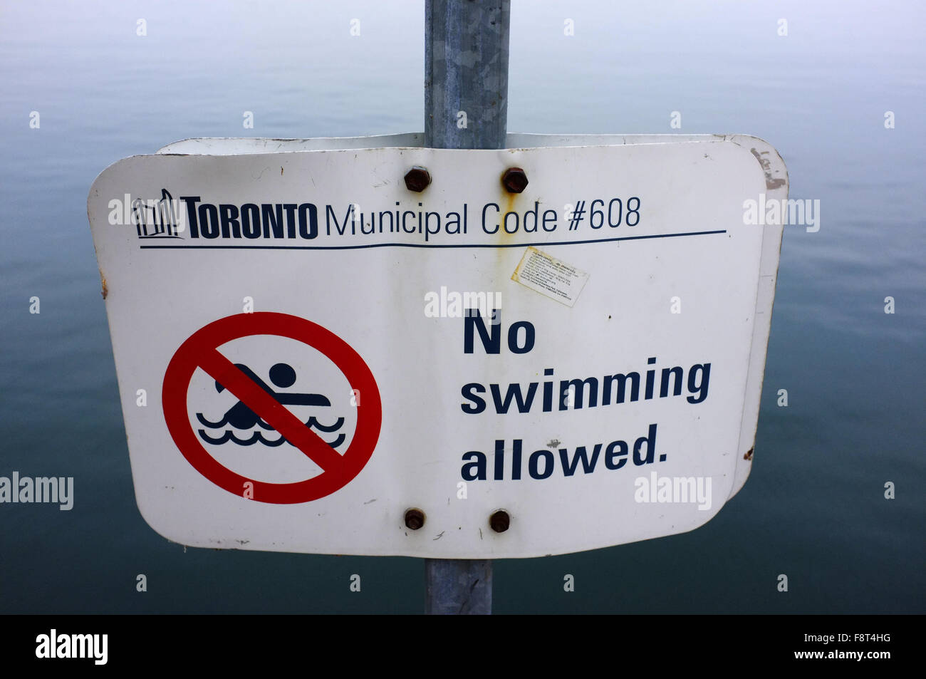 A No swimming allowed sign in the East Bayfront area of Toronto. Stock Photo