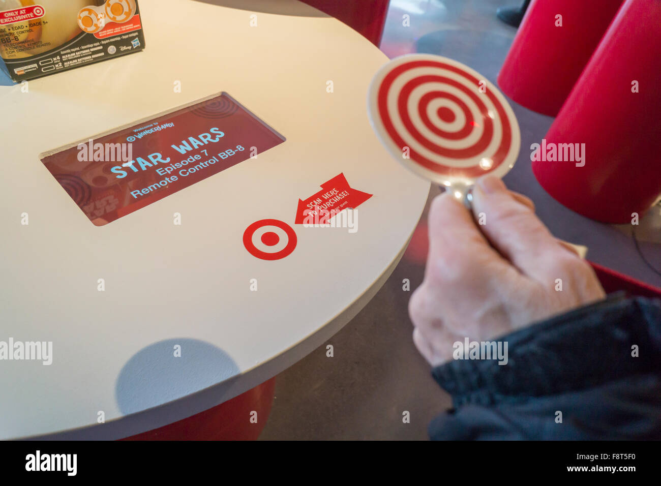 RFID receiver and token in the Target 'Wonderland!' pop-up store in the Meatpacking District in New York on its grand opening day, Wednesday, December 9, 2015. According to Target the store combines physical and digital shopping using medallions given to visitors with an embedded RFID chip. Tapping the chip to an antenna near the product lets you order it. The store is an experiment in technology replacing shopping carts with chips.  (© Richard B. Levine) Stock Photo