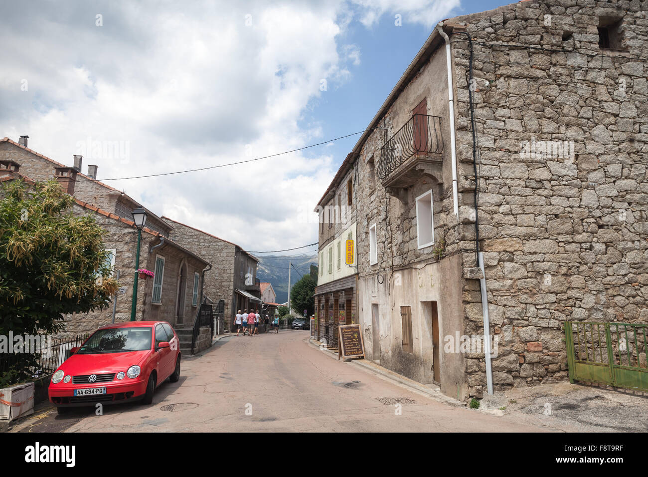 Zonza, France - July 1, 2015: Corsican village street view, old stone houses along the road. Zonza, South Corsica, France Stock Photo