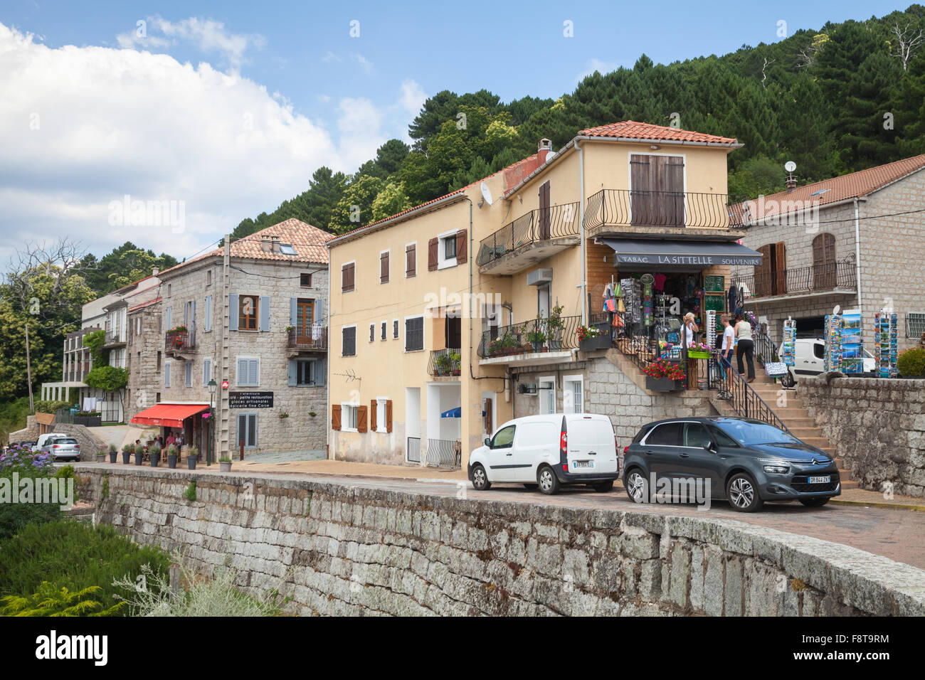 Zonza, France - July 1, 2015: Corsican village street view, old stone houses along the road. Zonza, South Corsica Stock Photo