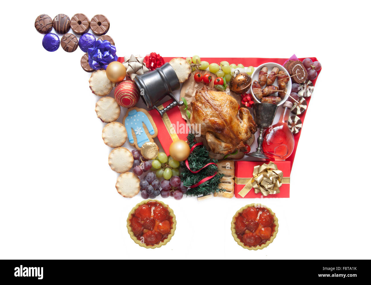 Christmas foods, drinks and presents in the shape of a shopping cart symbol Stock Photo