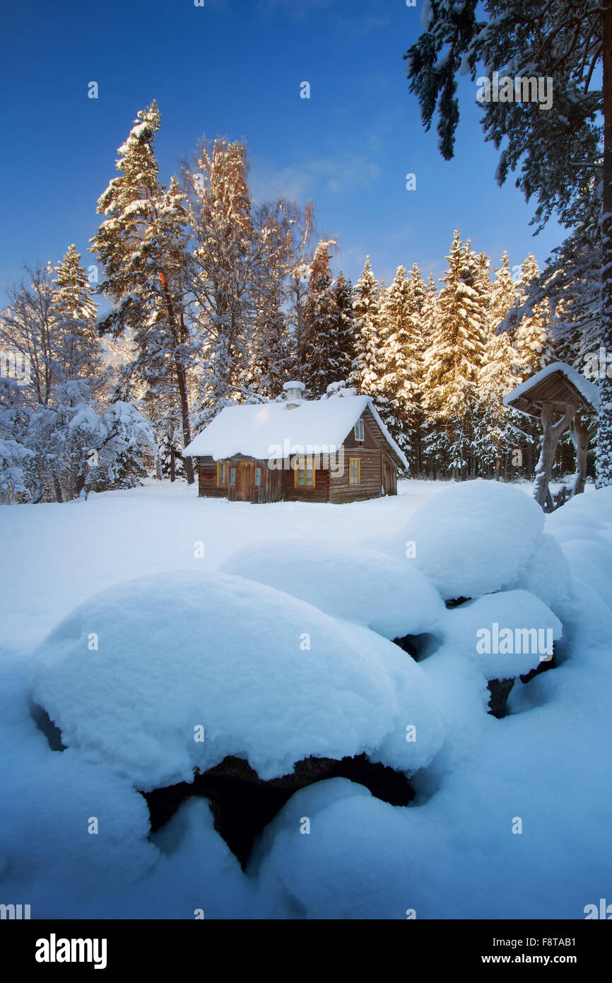 Old house in snowy forest hi-res stock photography and images - Alamy