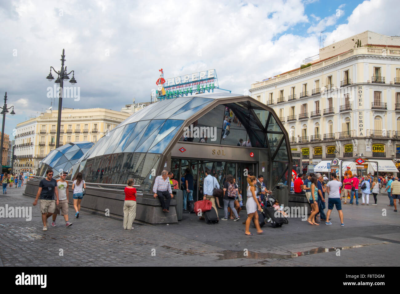 Cercanias station entrance and Tio Pepe neon sign on its new location. Puerta del Sol, Madrid, Spain. Stock Photo