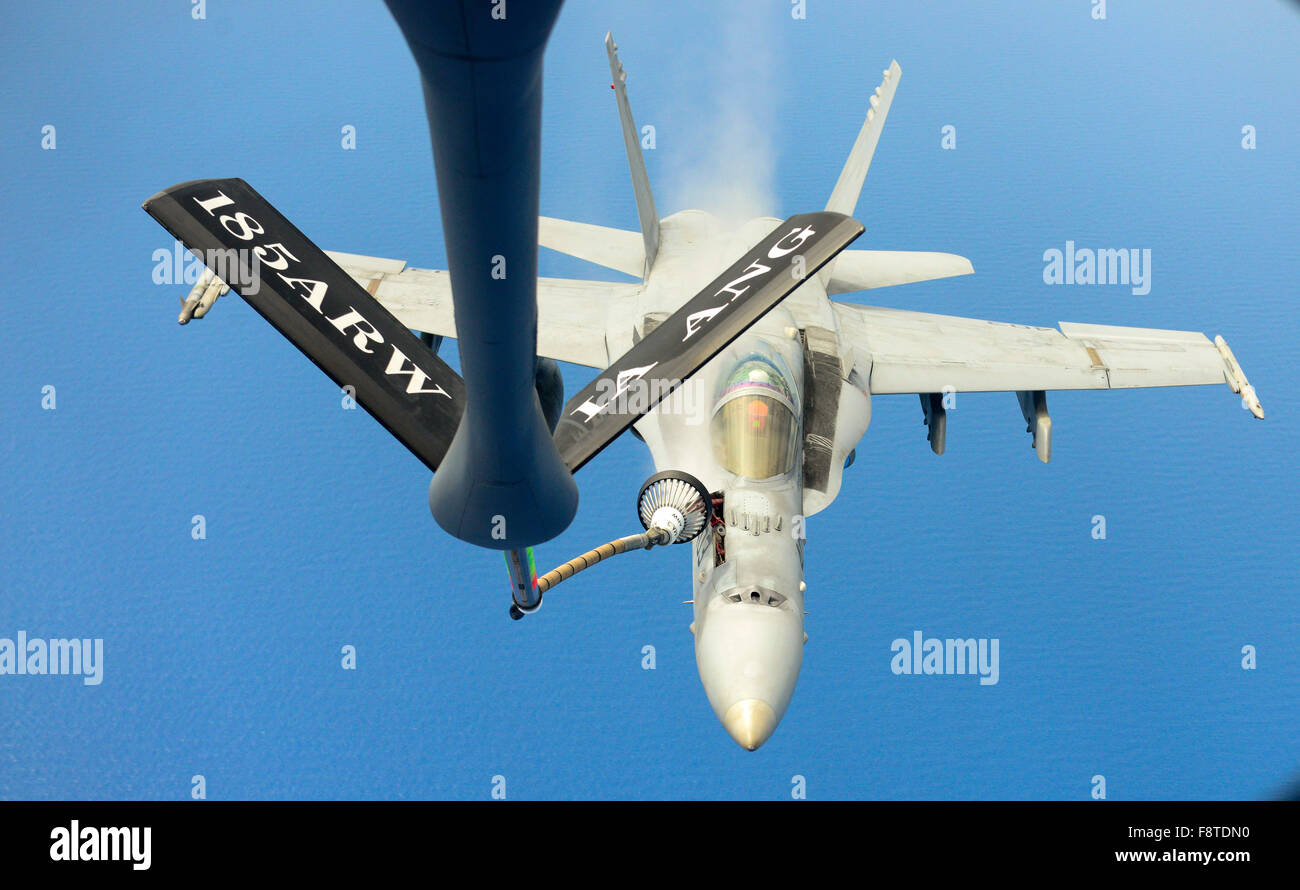 McDonnell Douglas F/A 18C Hornet fighter jet aircraft, A Navy F/A 18C Hornet from Strike Fighter Squadron 34 (VFA 34), also known as the Blue Blaster, breaks away after conducting an aerial refueling with a KC-135 from the 185th Air Wing Stock Photo
