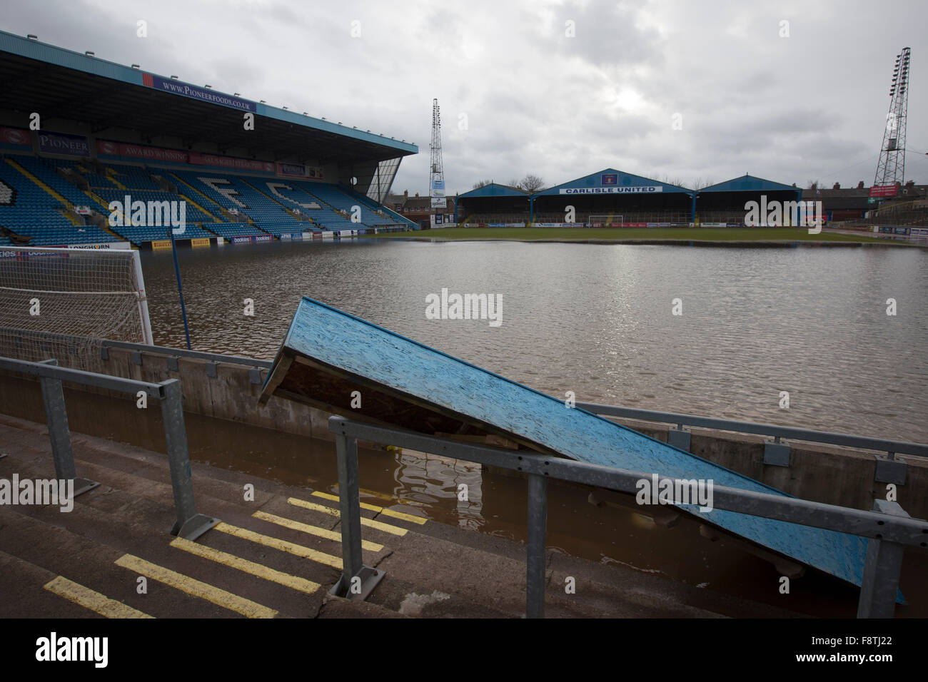 Flooding on the pitch at Brunton Park, home of Carlisle United Football Club. Record rain fall in Cumbria caused flooding to several areas of Carlisle, causing houses to be evacuated by emergency services. Stock Photo