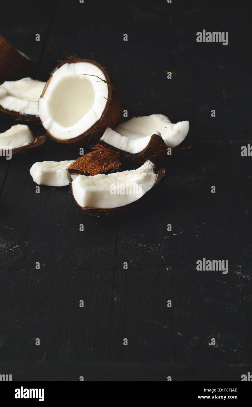 close up of coconut pieces on a wooden background Stock Photo