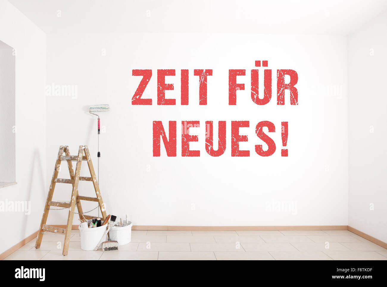 the text time for new service is painted on a wall with ladder and painting tools Stock Photo