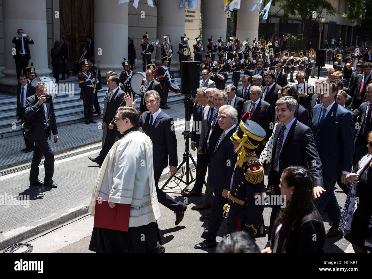 Buenos Aires, Argentina. 11th Dec, 2015. Argentina's President Mauricio Macri (C) waves while walking on May Avenue with his Cabinet to participate in the Tedeum at the Metropolitan Cathedral in Buenos Aires, capital of Argentina, Dec. 11, 2015. According to local press, Mauricio Macri Friday attended the traditional religious service at the Metropolital Cathedral, the day after his pesidential inauguration. Credit:  Martin Zabala/Xinhua/Alamy Live News Stock Photo