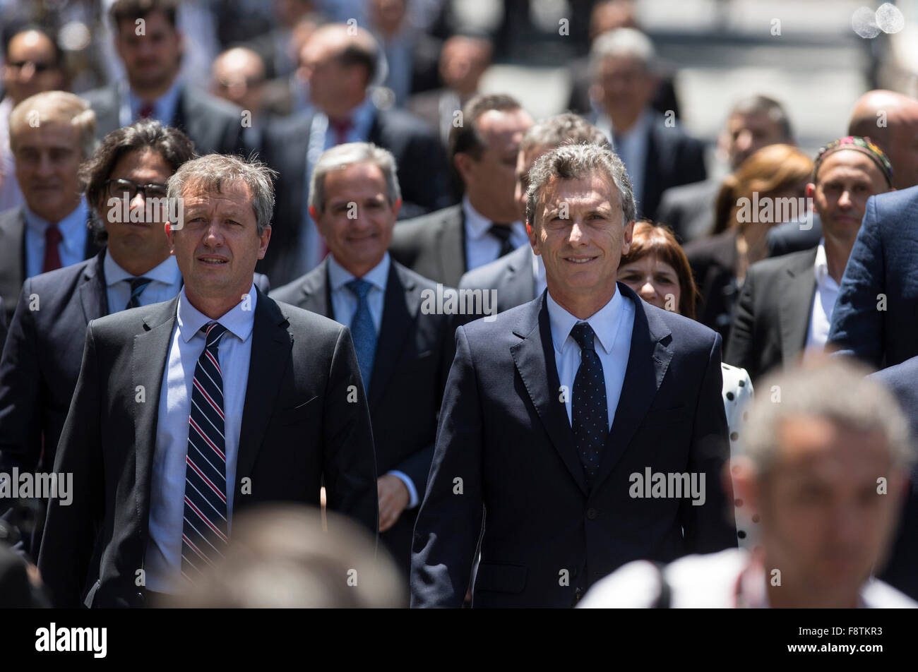 Buenos Aires, Argentina. 11th Dec, 2015. Argentina's President Mauricio Macri (R, front) walks on May Avenue with his Cabinet to participate in the Tedeum at the Metropolitan Cathedral in Buenos Aires, capital of Argentina, Dec. 11, 2015. According to local press, Mauricio Macri Friday attended the traditional religious service at the Metropolital Cathedral, the day after his pesidential inauguration. Credit:  Martin Zabala/Xinhua/Alamy Live News Stock Photo