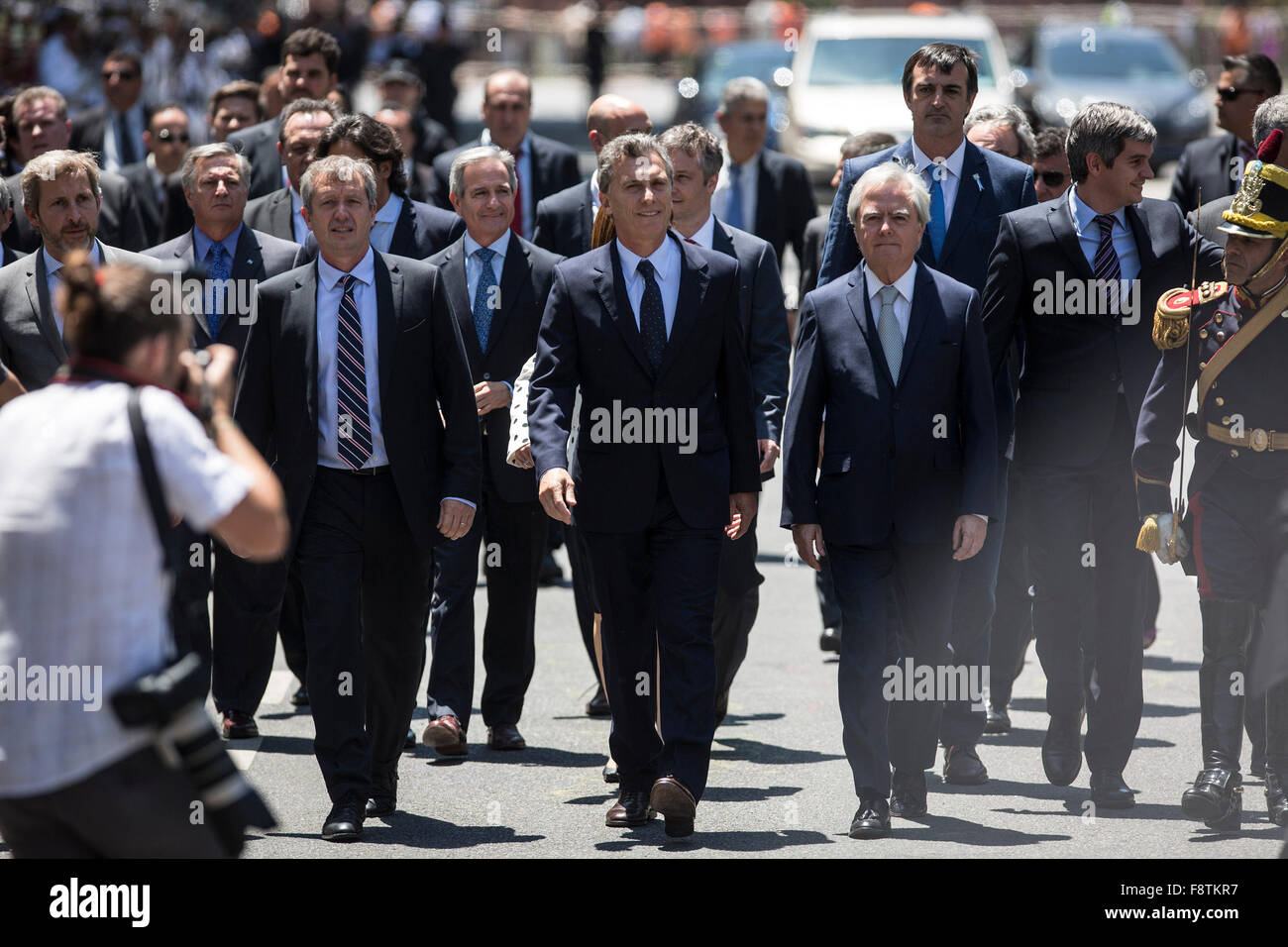 Buenos Aires, Argentina. 11th Dec, 2015. Argentina's President Mauricio Macri (C) walks on May Avenue with his Cabinet to participate in the Tedeum at the Metropolitan Cathedral in Buenos Aires, capital of Argentina, Dec. 11, 2015. According to local press, Mauricio Macri Friday attended the traditional religious service at the Metropolital Cathedral, one day after his pesidential inauguration. Credit:  Martin Zabala/Xinhua/Alamy Live News Stock Photo