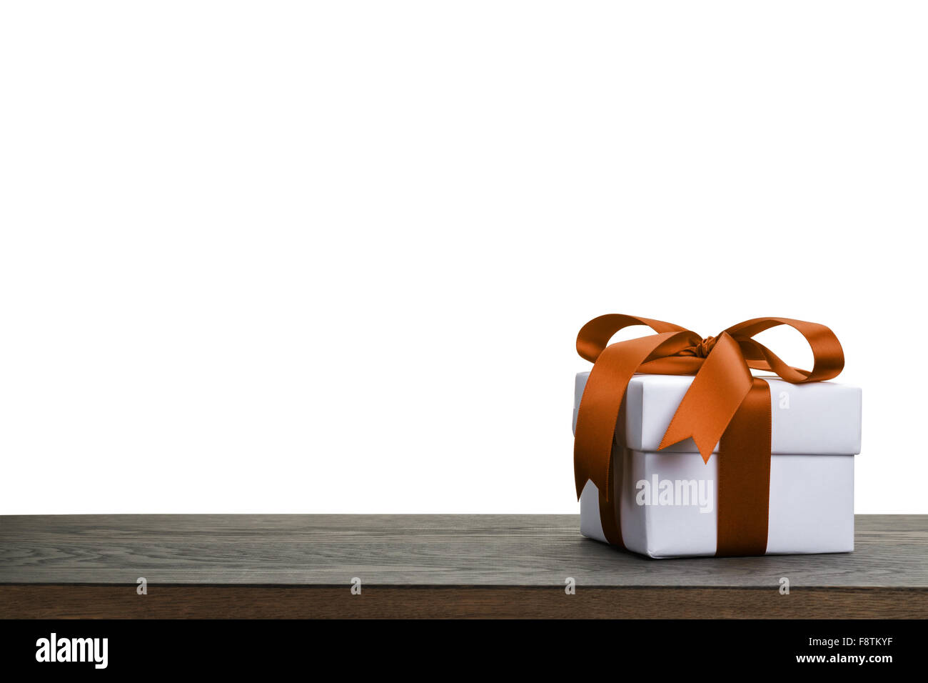border with white gift box with orange ribbon bow Stock Photo