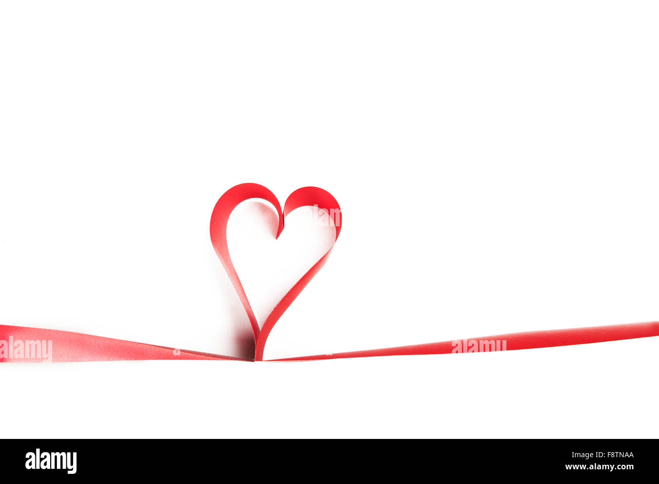 Heart shaped red ribbon isolated on white background Stock Photo - Alamy