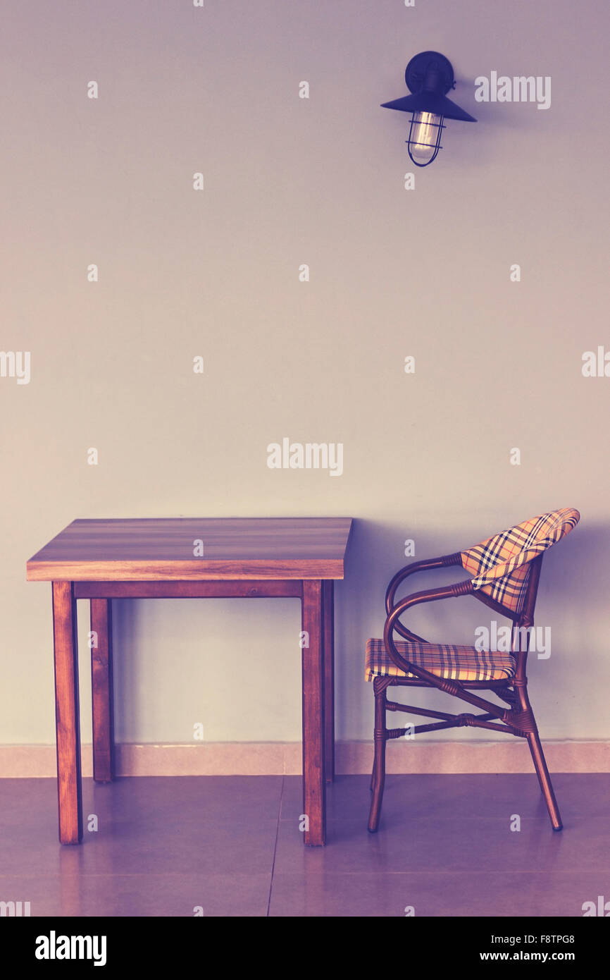 Wooden chair against wall hires stock photography and images Alamy