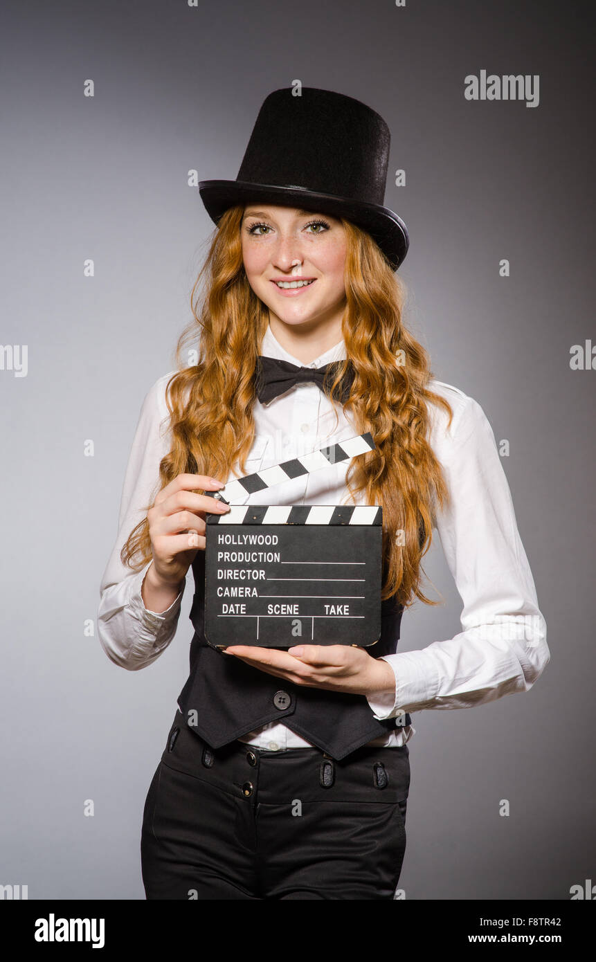 Pretty girl wearing retro hat isolated on gray Stock Photo - Alamy