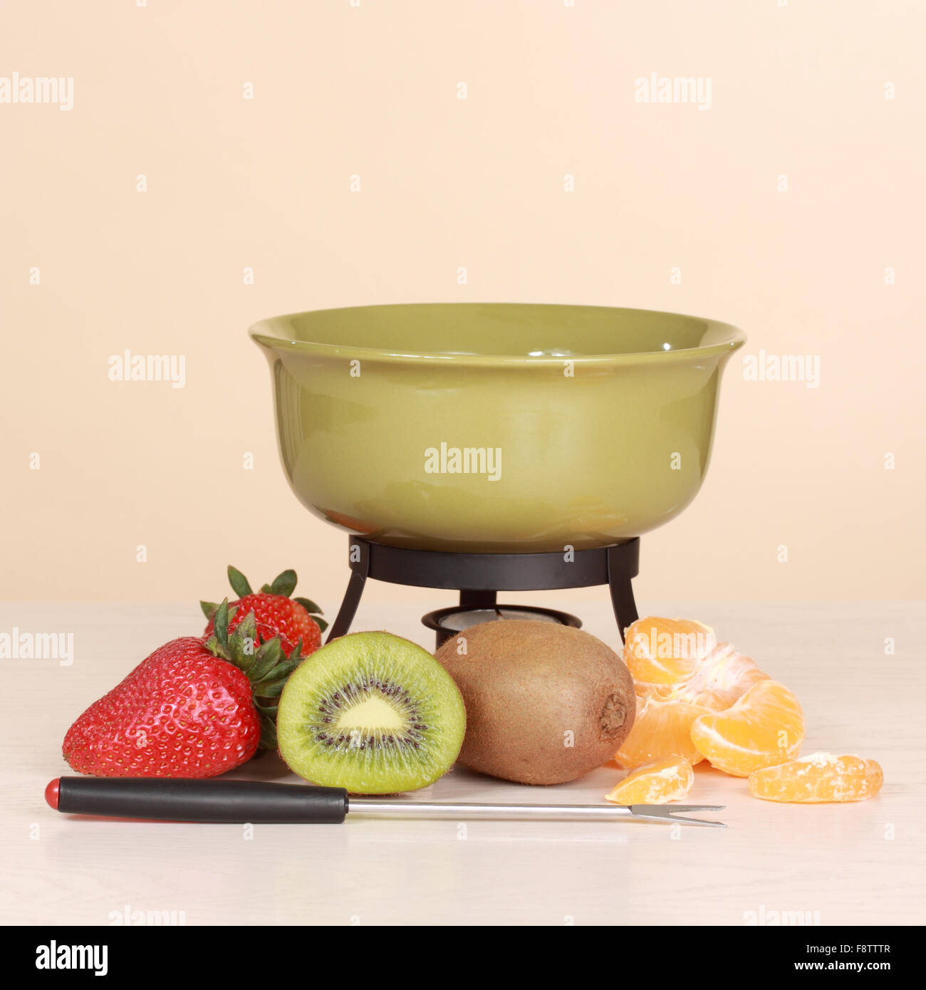 chocolate fondue kit and fruits Stock Photo Alamy