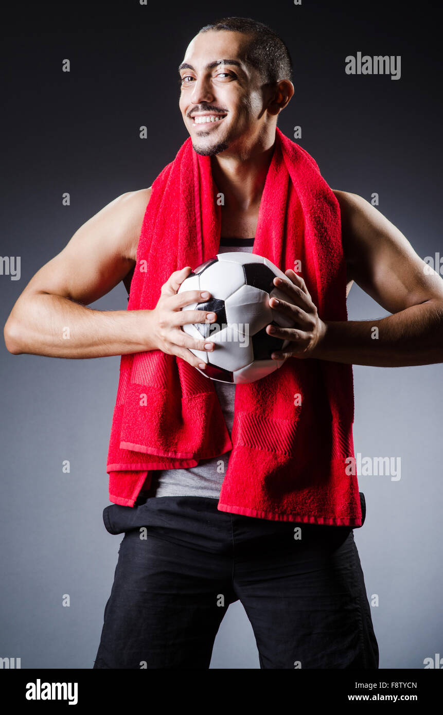 Football player with ball and towel Stock Photo Alamy