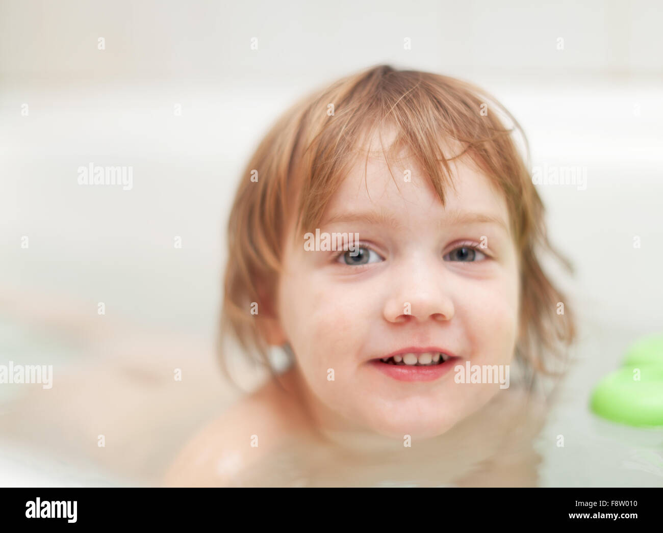 baby girl bathes in bath Stock Photo Alamy