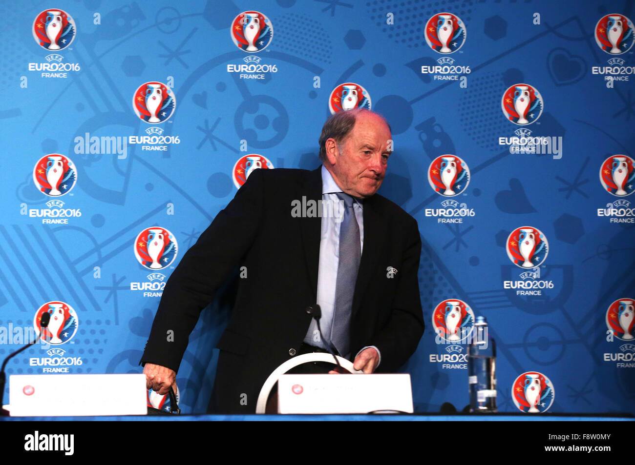 Paris, France. 11th Dec, 2015. The president of EURO 2016 SAS Jacques Lambert leaves the podium after a press conference held in Paris, France, 11 December 2015. Paris will host on 12 December the EURO 2016 Final Draw, to establish groups for the tournament. Photo: Christian Charisius/dpa/Alamy Live News Stock Photo