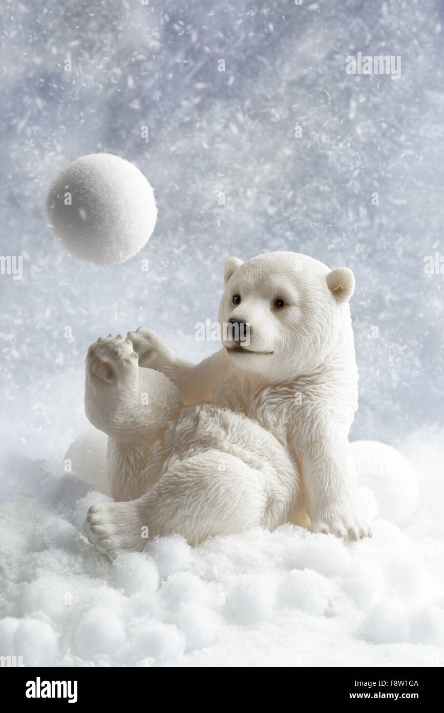 Polar bear winter decoration playing with a snowball Stock Photo