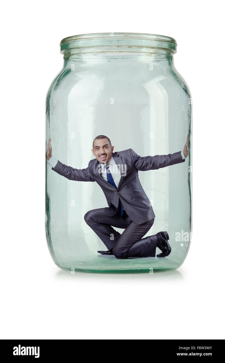 Young businessman in glass jar Stock Photo