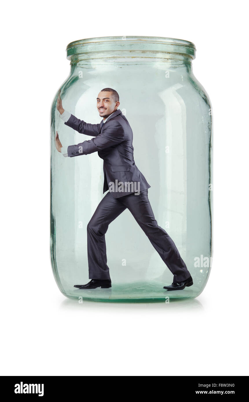 Young businessman in glass jar Stock Photo