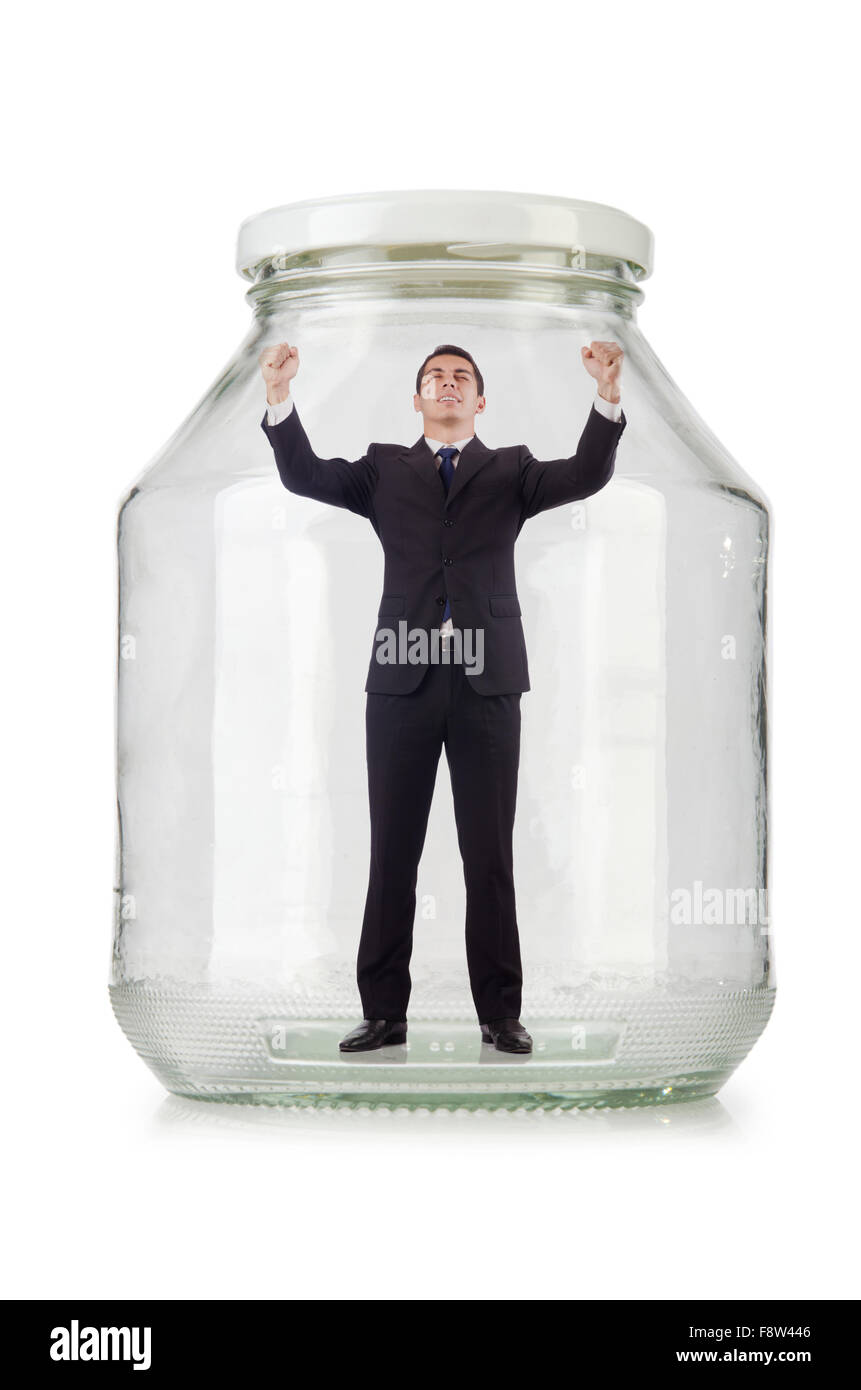 Young businessman in glass jar Stock Photo