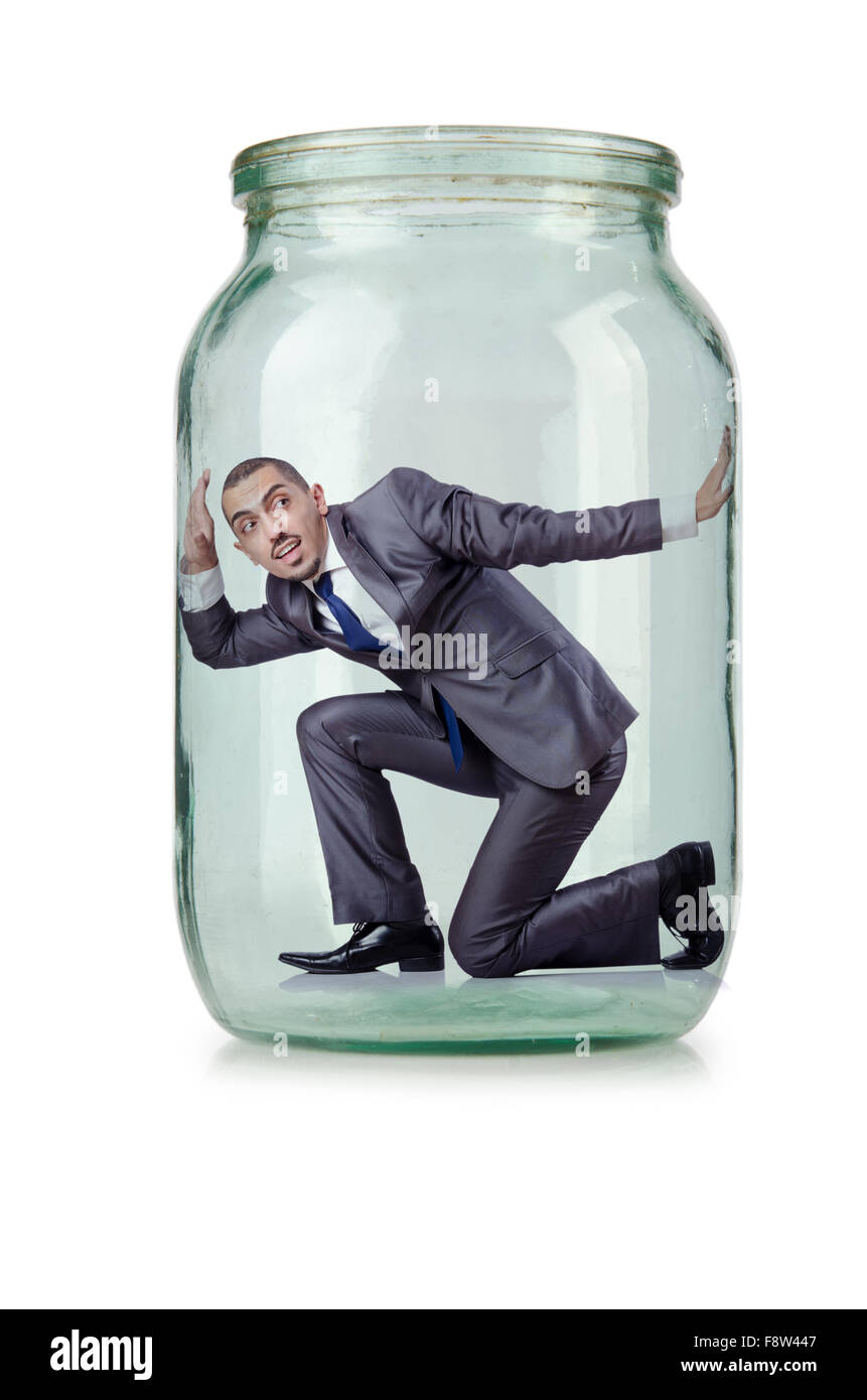 Young businessman in glass jar Stock Photo