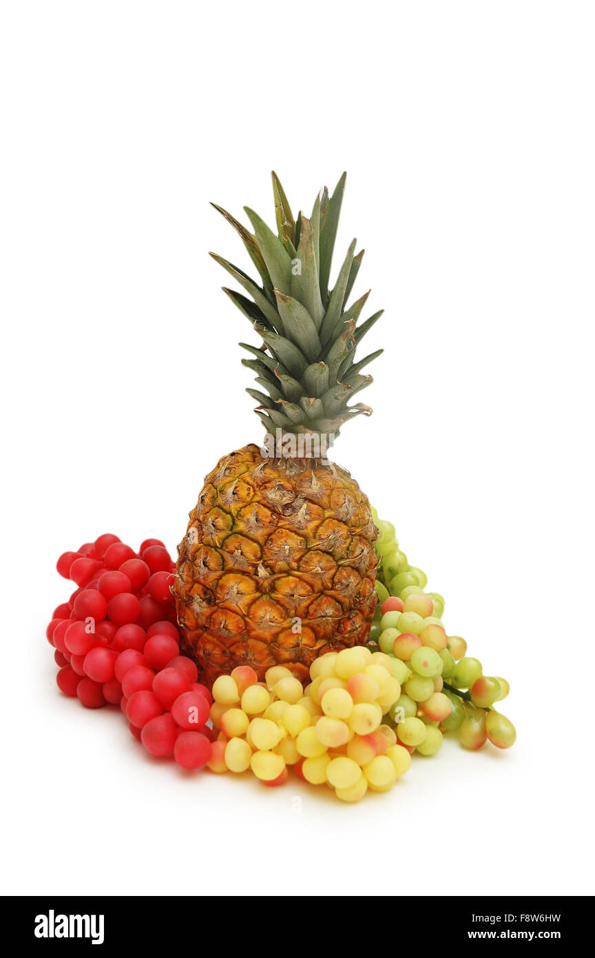 Grapes and pineapple isolated on white background Stock Photo Alamy