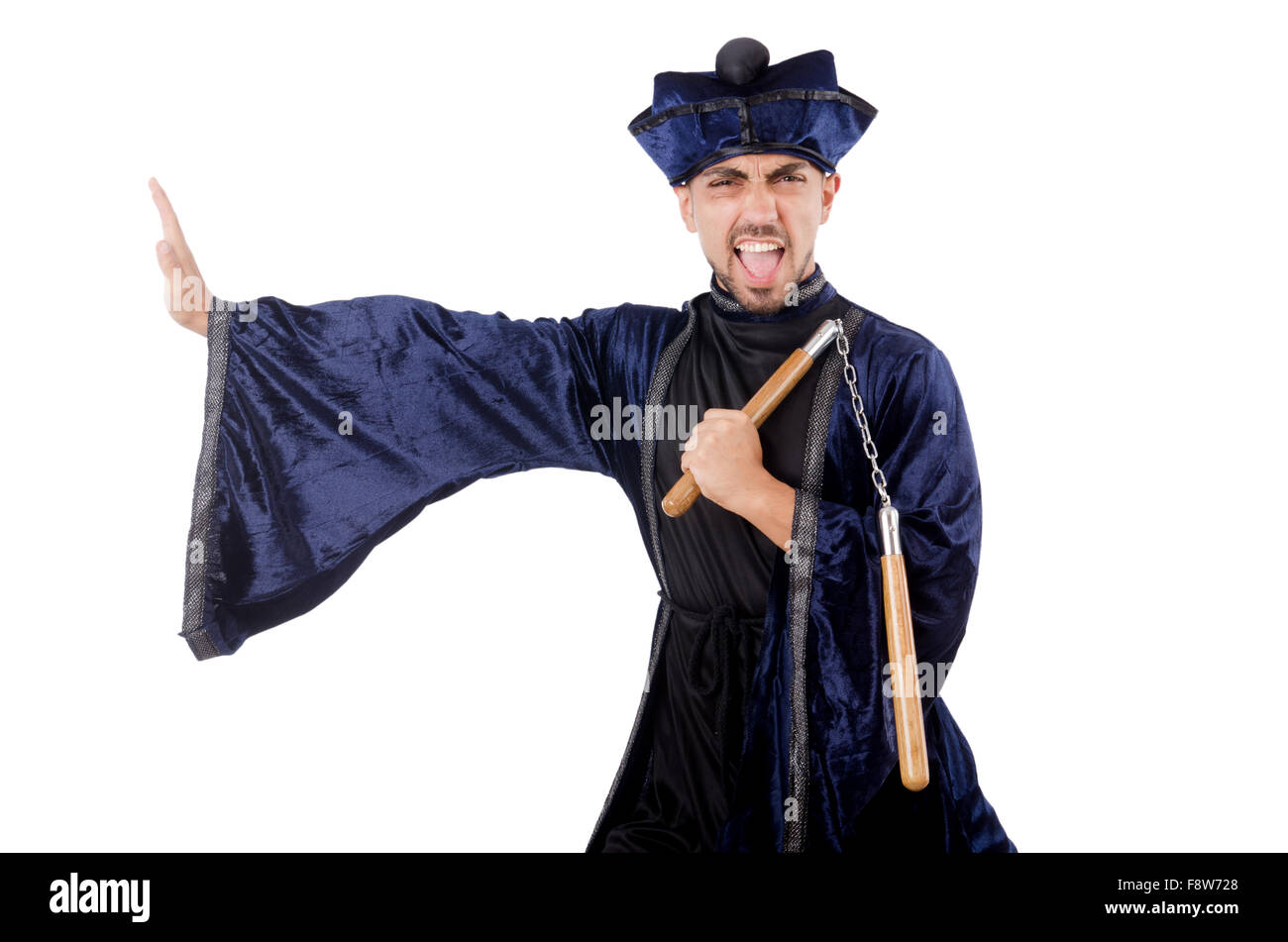 Martial arts master with nunchucks on white Stock Photo