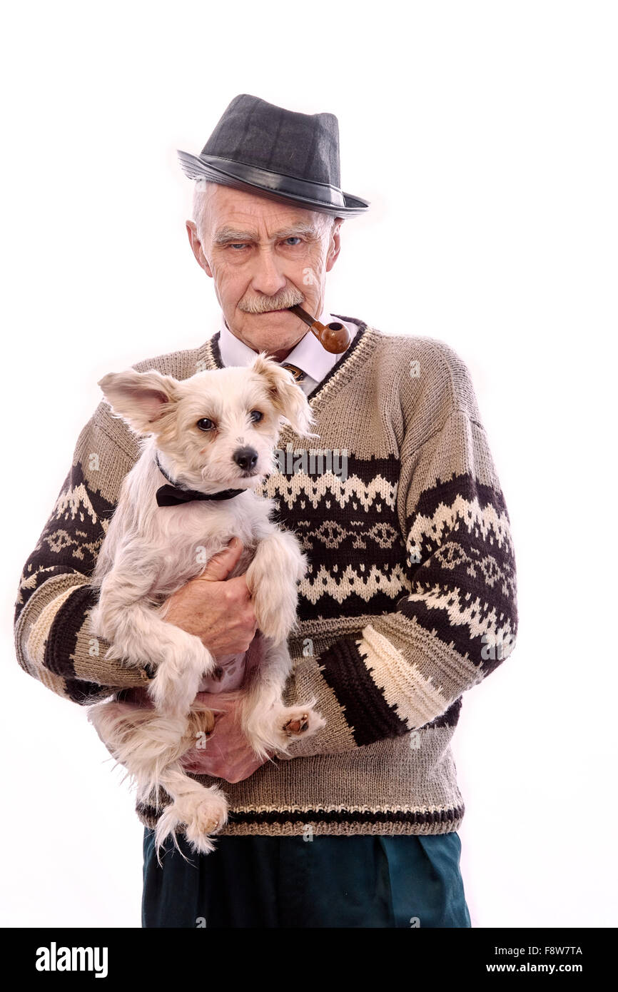 Cute grandpa with a dog sitting on his hands. Stock Photo
