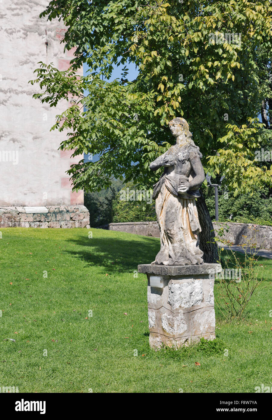 Baroque statue of Mary Magdalene in courtyard of Church of the Assumption of Mary on lake Bled island in Slovenia Stock Photo