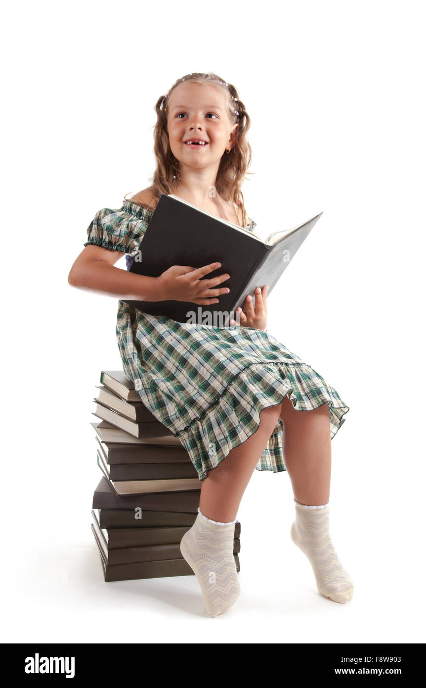 Smiling little girl with a book Stock Photo - Alamy