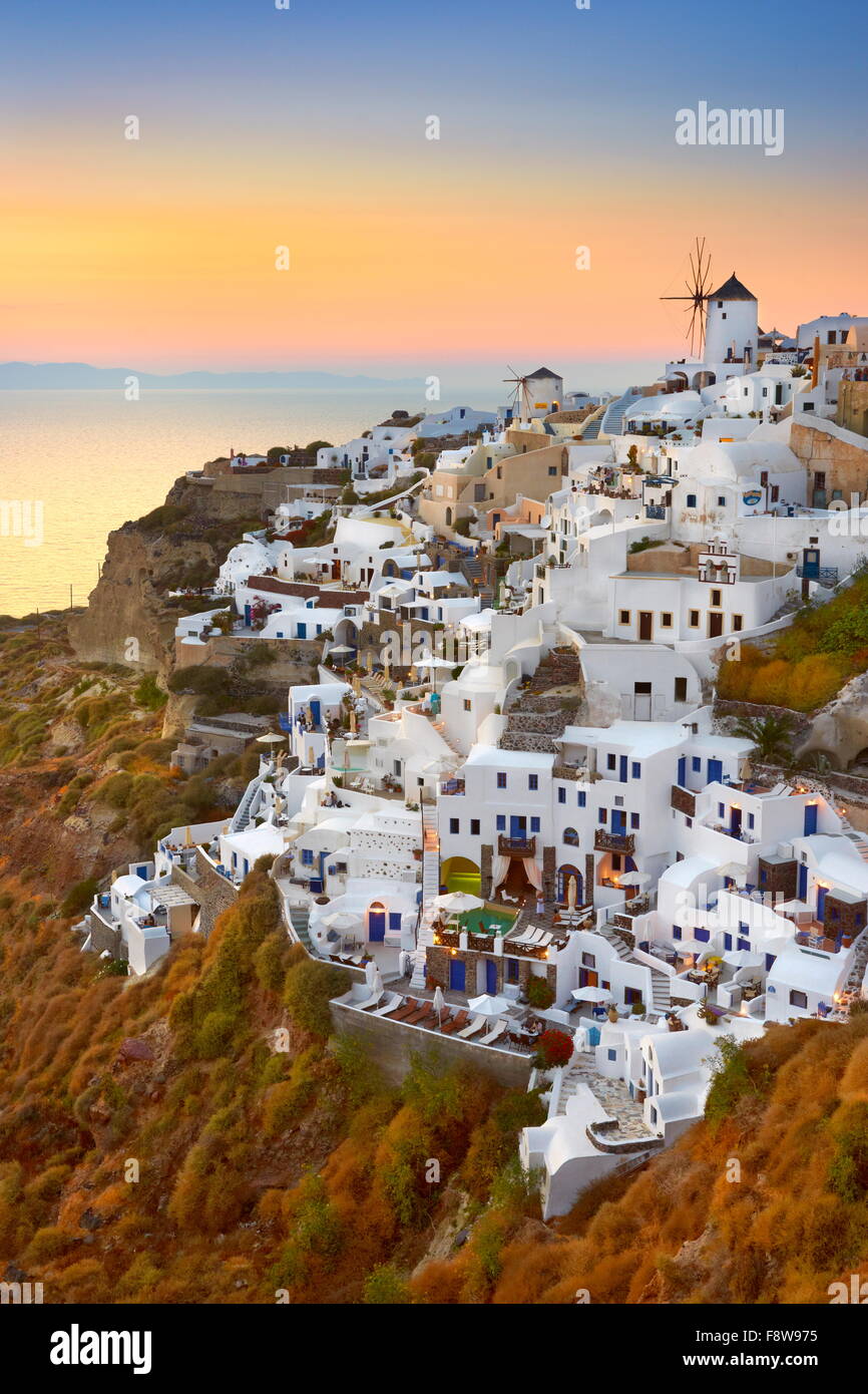 Santorini - view of Oia Town and windmills at sunset time, Greece Stock Photo