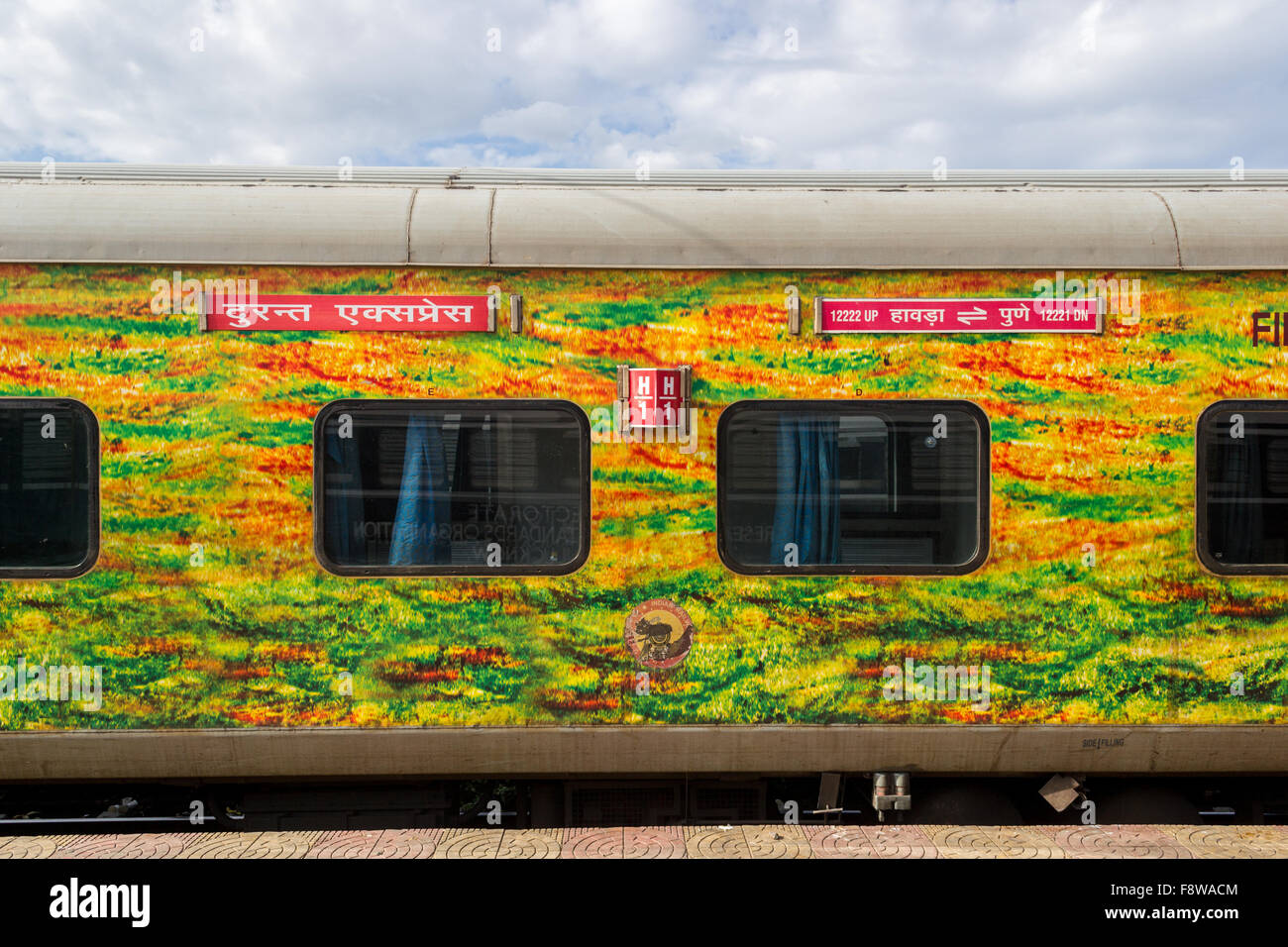 AC 1st Class coach 12221 Pune Howrah AC Duronto Express in characteristic yellowgreen livery