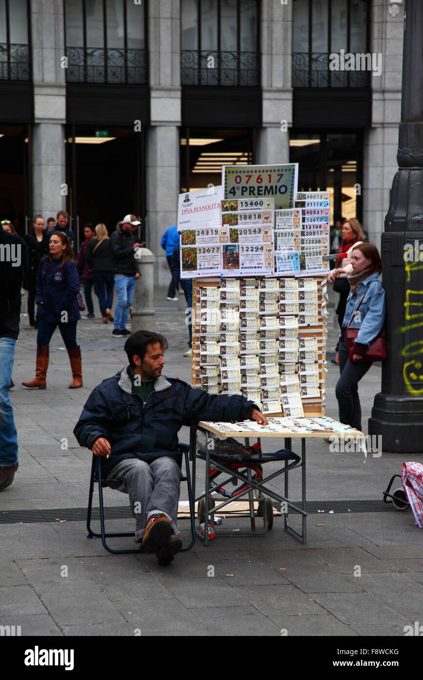 Madrid, Spain 11th December 2015: Lottery ticket sellers selling tickets for the Christmas Lottery in Plaza Puerta del Sol in central Madrid. The Spanish Christmas Lottery is one of the oldest in the world and the biggest in the world in terms of total payout. The winning ticket is known as 'El Gordo' ('The Big One' or 'The Fat One'). Credit:  James Brunker/Alamy Live News Stock Photo