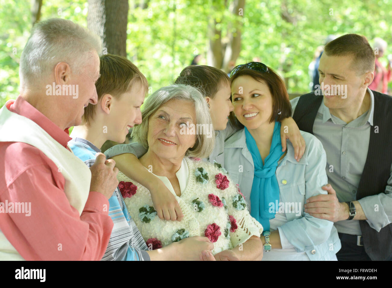 Family relaxing in summer park Stock Photo